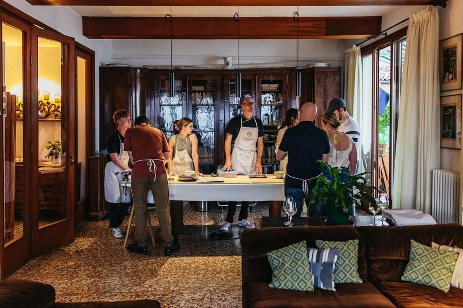 Venice: Pasta and Tiramisu Cooking Class at a Local's Home - Sitting down to eat what you made